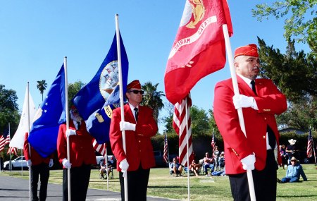 Members of the Marine Corps League Kings County Detachment 455 march with service flags.
